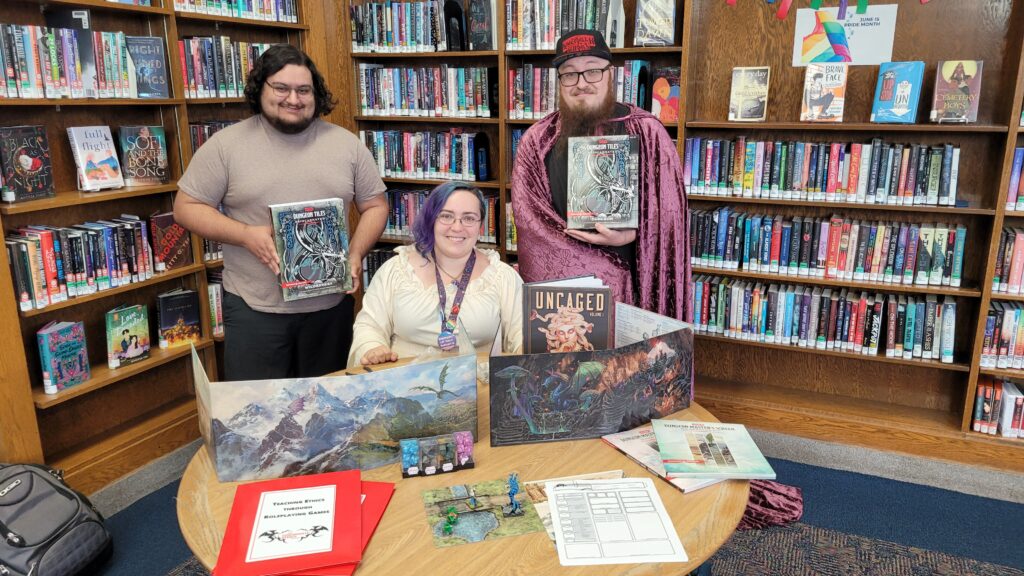 Picture of UC Philosophy grad students and UC staff at Westwood Public Library for teaching ethics through roleplaying games. g