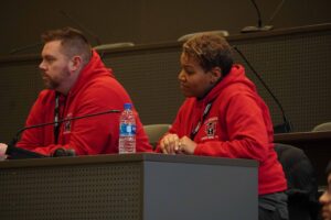 Photo of Mt. Healthy coaches watching team during semi finals