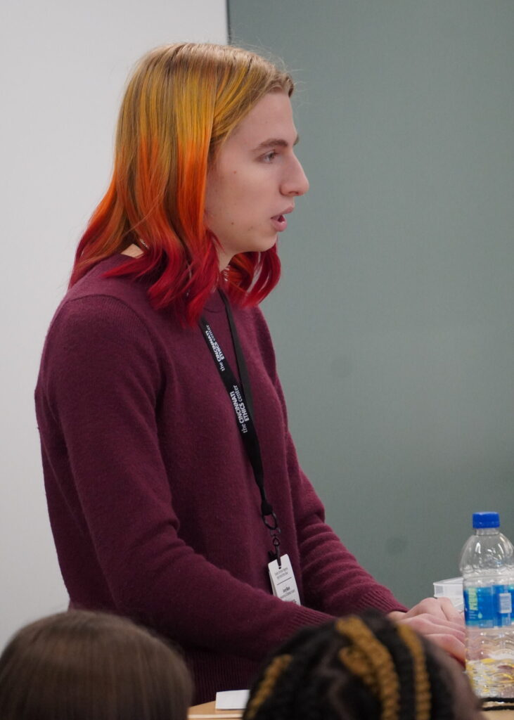 Volunteer moderator administering a preliminary round