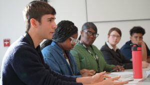 Image of 5 students participating in an ethics bowl competition which was designed to cultivate civil discourse skills.