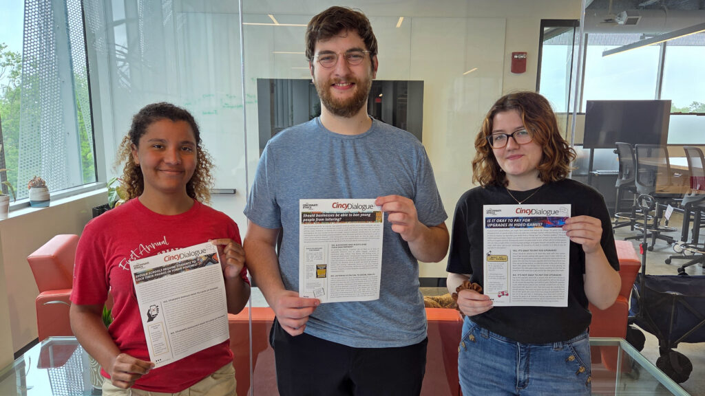 Cincinnati Ethics Center interns Kate Cotton, Kyle Young, and Gwen Schumann pictures holding their ethics explainers.